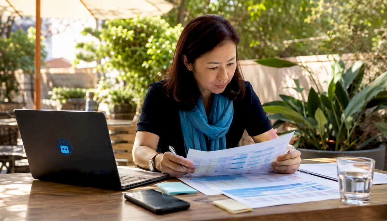 1784572260260_woman-reviewing-website-migration-documents woman reviewing website migration documents